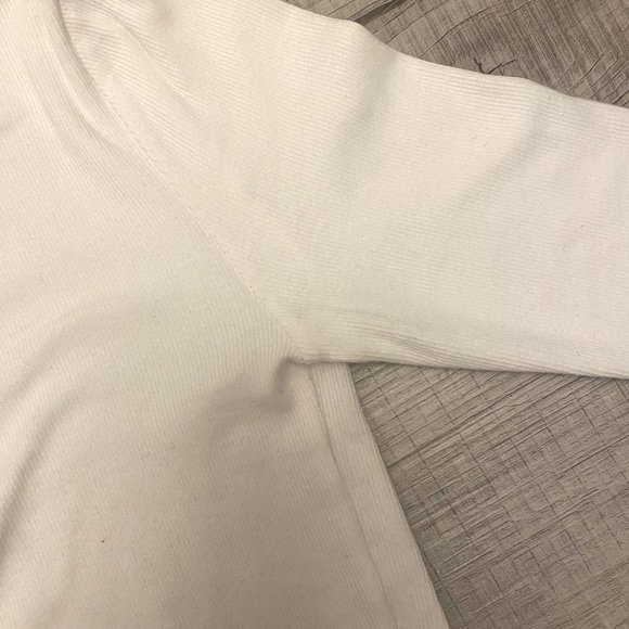 This a white long sleeve, TNA shirt that is still in the stores to this day - Picture 4 of 5